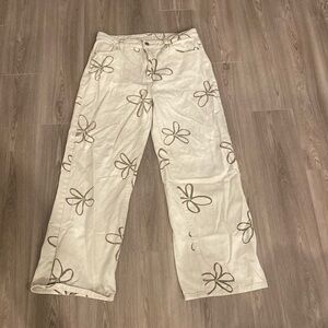floral tan jeans, size large